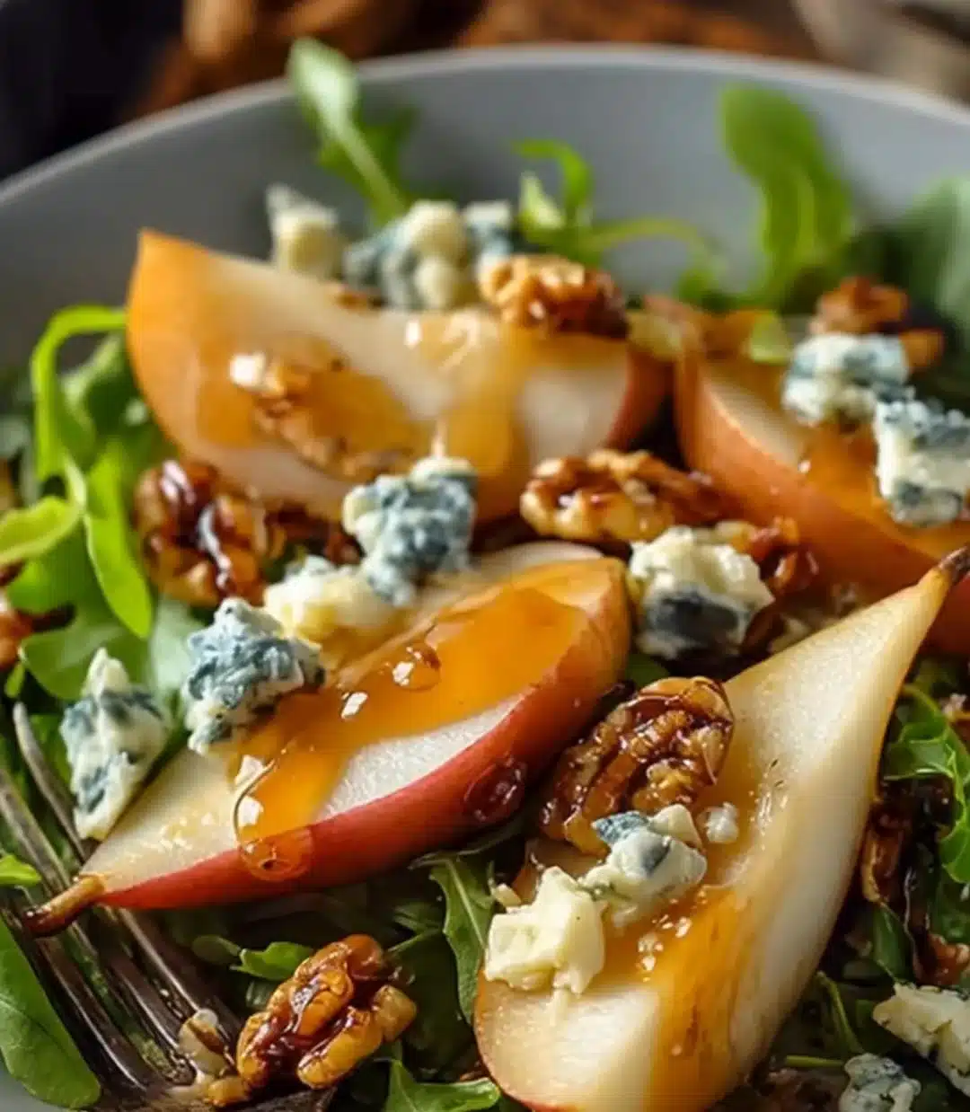 Caramelized Pear and Blue Cheese Salad 1 Caramelized pear and blue cheese salad with mixed greens and walnuts