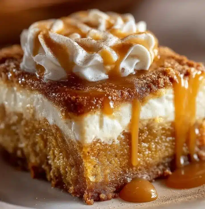 Delicious Pumpkin Spice Gooey Cake with creamy frosting and spices