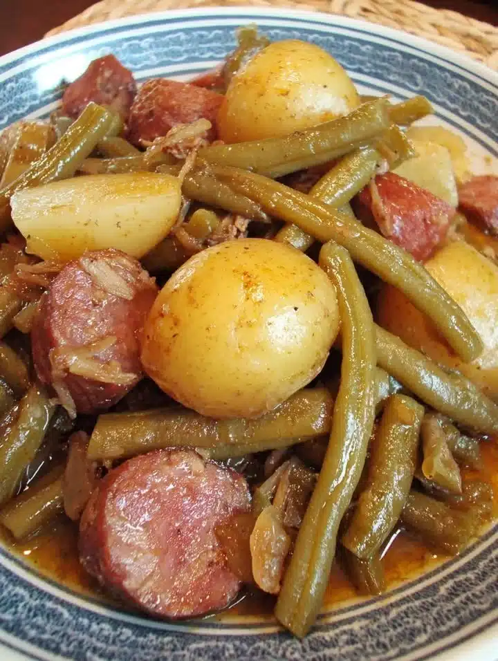 Green Beans and Smoked Sausage Stew 1 Delicious Green Beans and Smoked Sausage Stew served in a bowl.