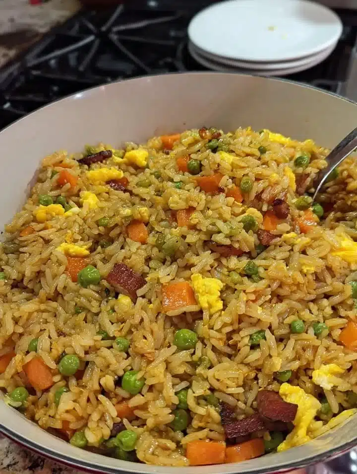 Homemade Fried Rice 1 Delicious homemade fried rice served in a bowl with colorful vegetables and eggs