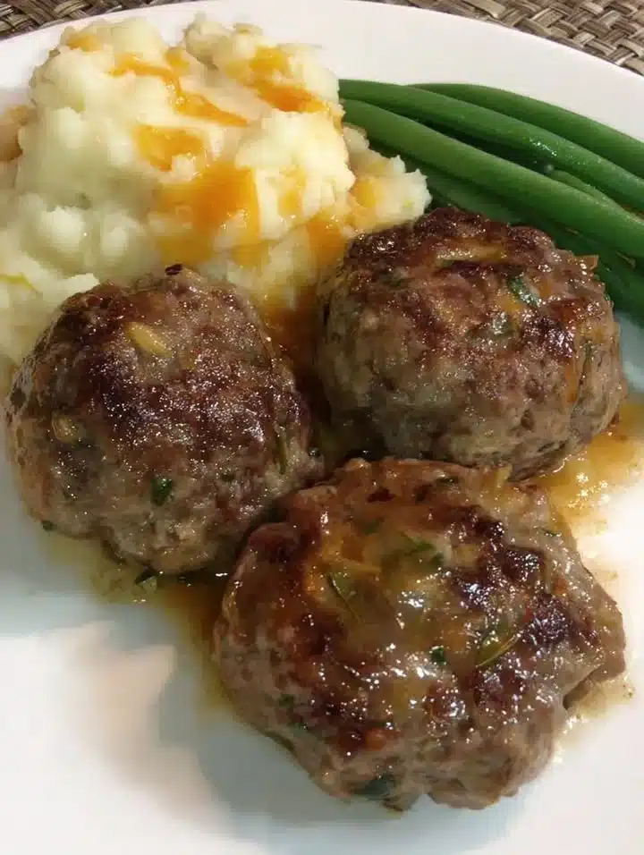 Delicious veggie-infused beef meatballs served on a wooden plate