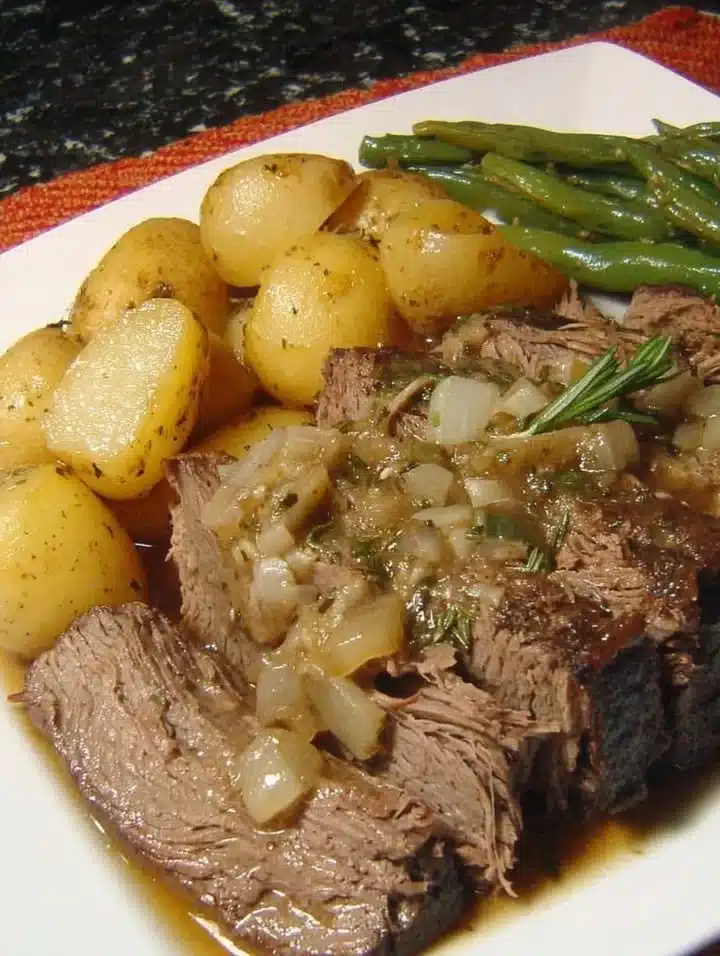 Rosemary Garlic Sirloin Roast garnished with herbs and spices.