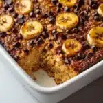 Delicious banana chocolate chip baked oatmeal in a bowl, perfect for breakfast.