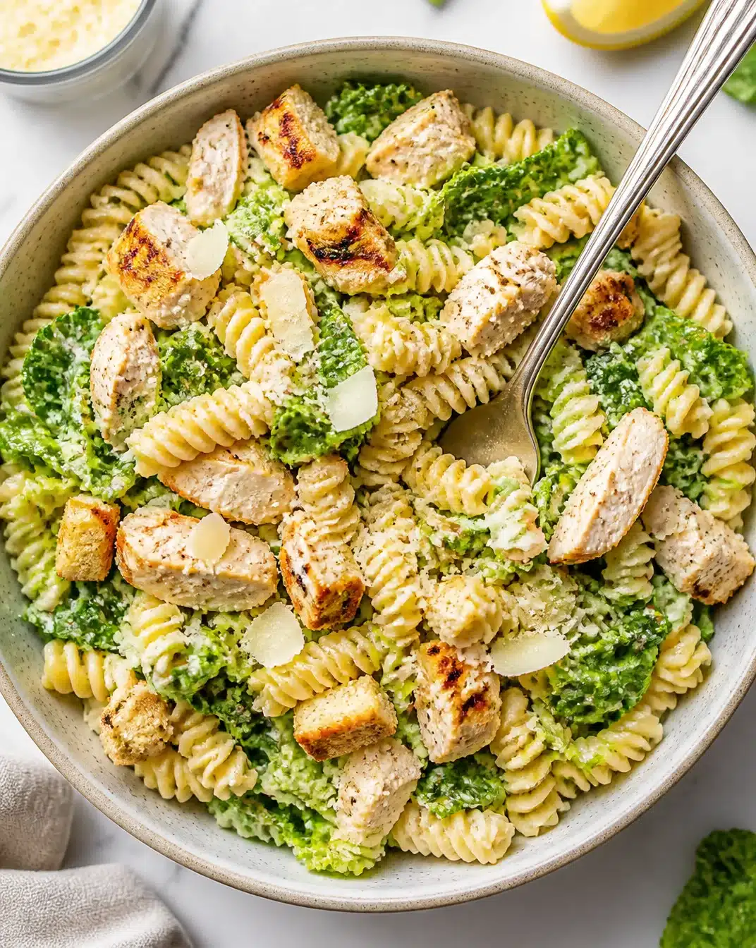Caesar Chicken Pasta Salad with grilled chicken, pasta, and Caesar dressing