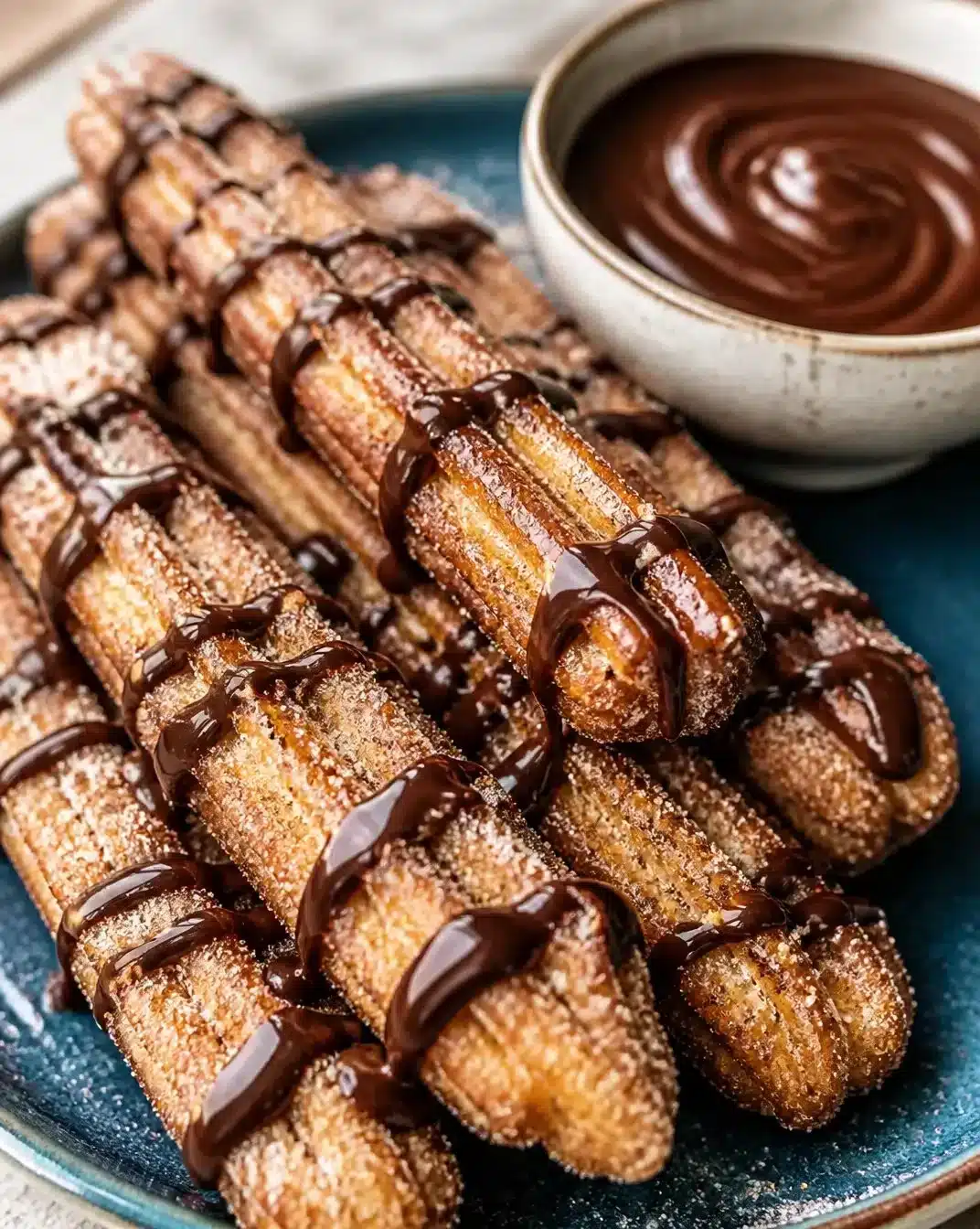 Delicious churro toffee drizzled with chocolate and sprinkled with cinnamon sugar