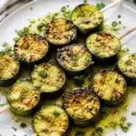 Garlic Butter Grilled Zucchini Skewers on a grill
