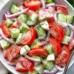 Fresh and colorful Simple Tomato Salad with herbs and dressing