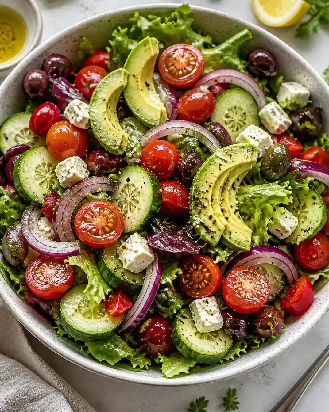 A colorful summer salad featuring fresh vegetables and fruits.