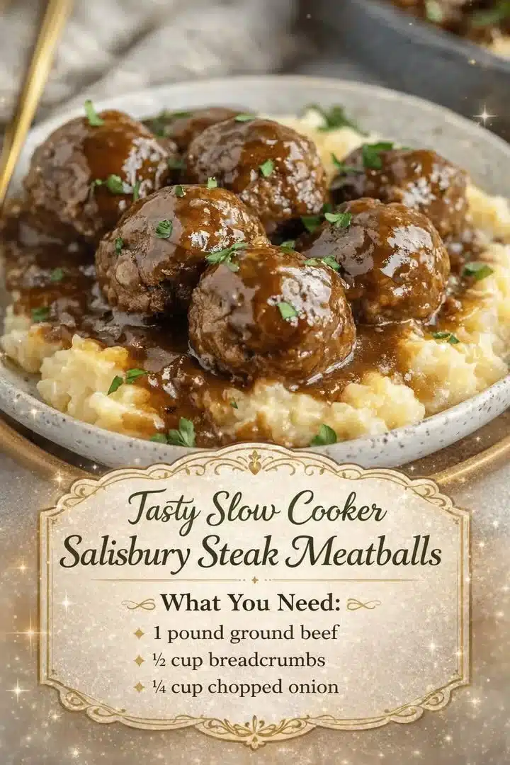 Slow cooker Salisbury steak meatballs served on a plate with gravy and mashed potatoes.
