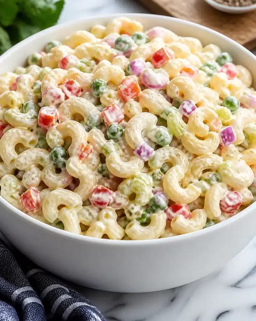 Ultimate macaroni salad featuring creamy dressing and fresh vegetables
