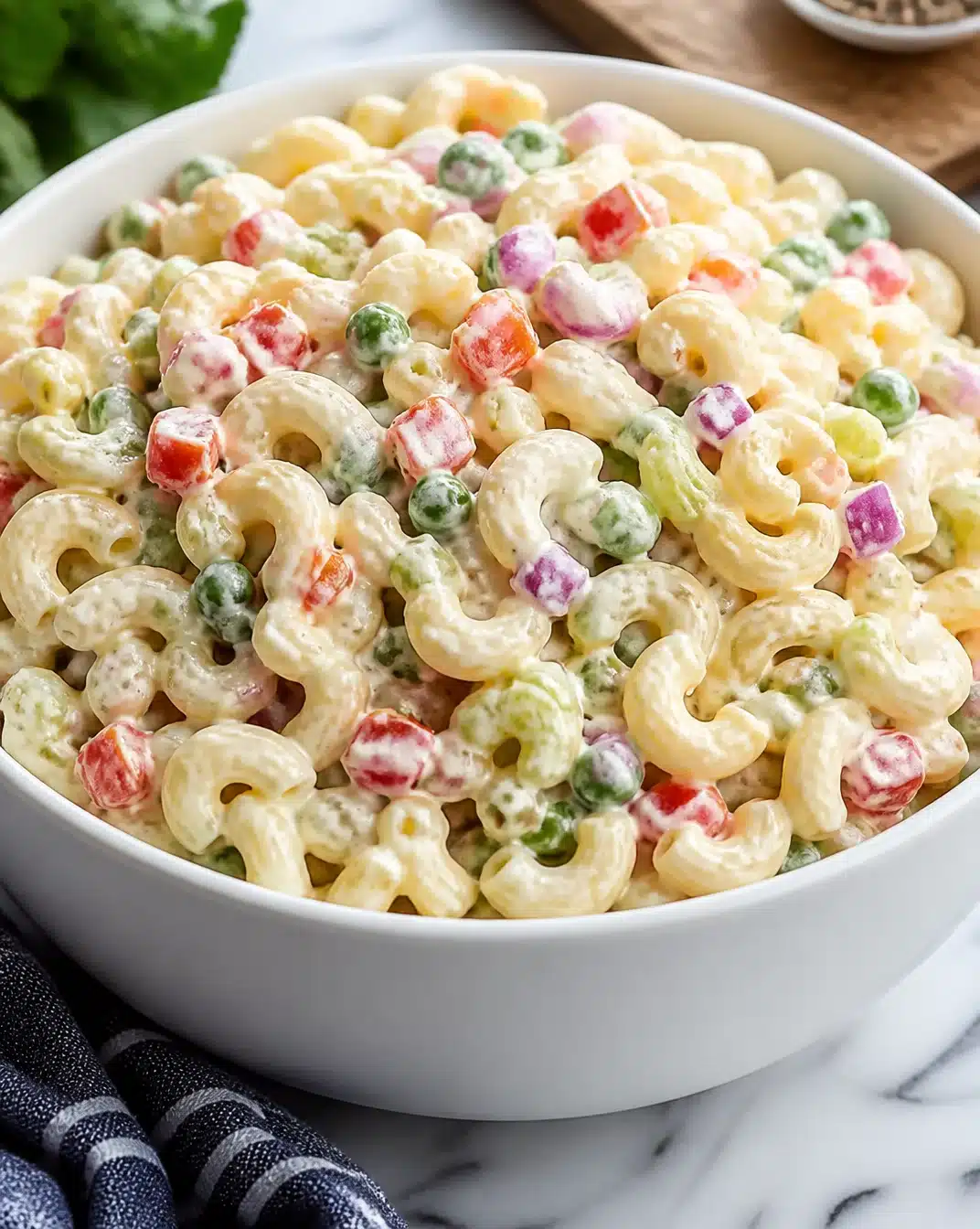 Ultimate macaroni salad featuring creamy dressing and fresh vegetables