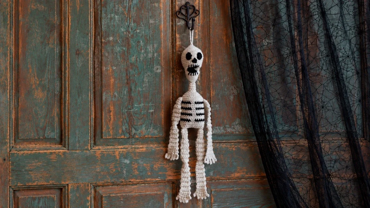Crochet hanging skeleton pattern on a rustic front door